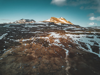 Aerial drone photo of a empty lake a huge volcanic mountain Snaefellsjokull in the distance, Reykjavik, Iceland.