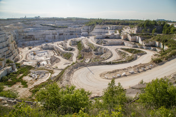 Fototapeta na wymiar Marble limestone ore white quarry open pit mining technology