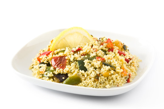 Couscous with vegetables isolated on white background