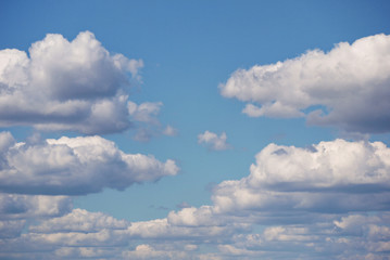 Fototapeta na wymiar The sky with white fluffy clouds. Like the Simpsons screensaver
