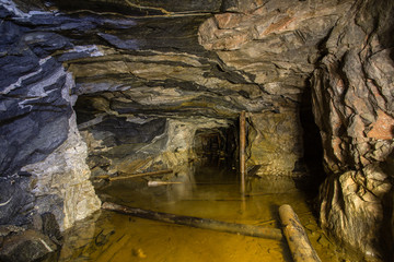 Fototapeta premium Underground abandoned ore mine shaft tunnel gallery
