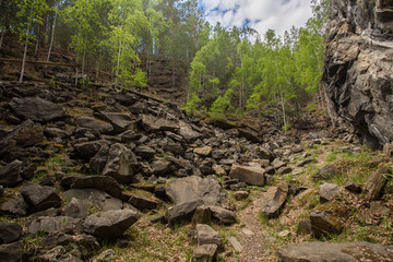 Abandoned ore mica mine quarry open pit in forest