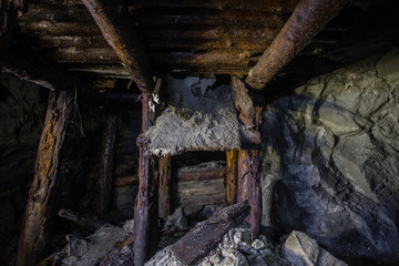 Fototapeta premium Underground abandoned ore mine shaft tunnel gallery
