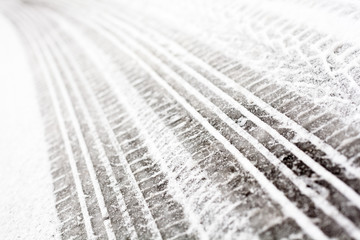 Wheel tracks on the road covered with snow © rootstocks