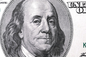 Dollars closeup. Benjamin Franklin's portrait on a  bill.Concept of money and earnings.
