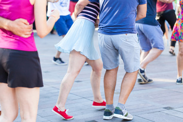 Fototapeta na wymiar Group of people dancing swing outdoors