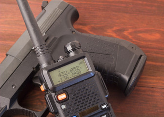 walkie talkie and gun