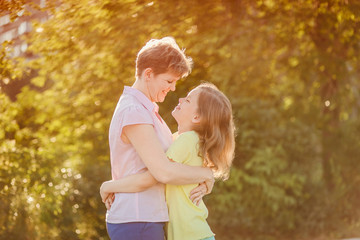Fototapeta premium mom and daughter look at each other
