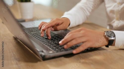 Busy Businessman Typing On Laptop Keyboard Wearing Pristine White