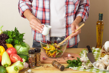 Woman cooks at the kitchen