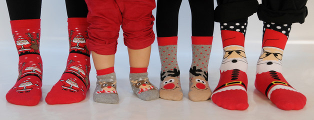 Family of four wearing Christmas socks