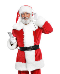 Santa Claus listening to Christmas music on white background