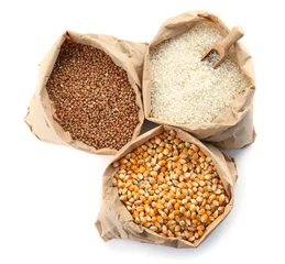 Poster Paper bags with different types of grains and cereals on white background © New Africa