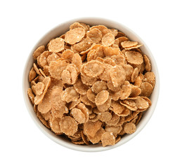 Bowl with wheat flakes on white background. Healthy grains and cereals