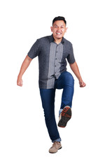 Fototapeta premium Photo image portrait of a young Asian male student stepping forward, side view, isolated on white