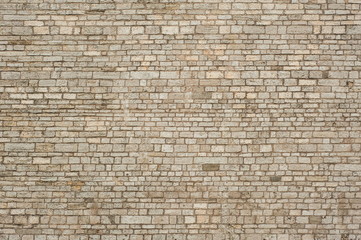 Brick wall texture for design. Part of the wall of the ancient castle as a texture.