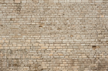 Brick wall texture for design. Part of the wall of the ancient castle as a texture.