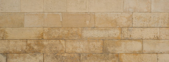 Stone wall texture for design. Part of the wall of the ancient castle as a texture.
