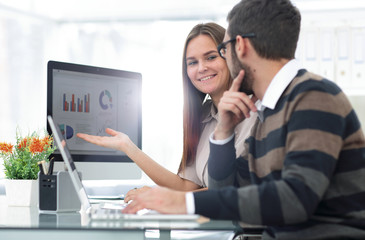 business colleagues discussing financial charts