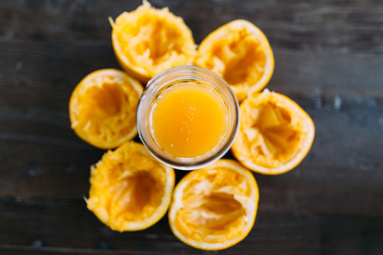 Juiced Orange Peels in a Circle around Juice