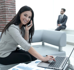 Woman assistant at her workplace.