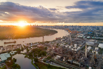 Fototapeta premium Aerial view of twilight of oil refinery ,Shot from drone of Oil refinery and Petrochemical plant at dusk , Bangkok, Thailand