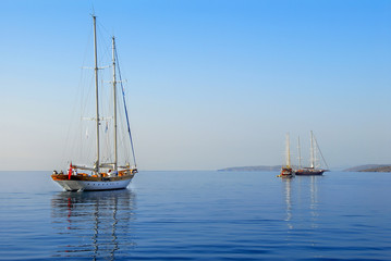 Fototapeta na wymiar Bodrum, Turkey, 25 October 2010: Gulet Wooden Sailboats at Cove of Kumbahce