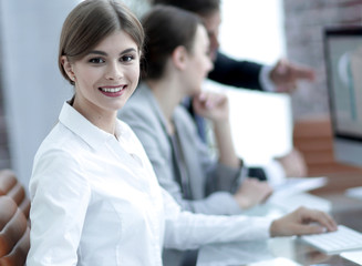 Obraz premium young employee sitting at a Desk