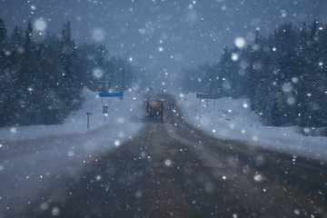 snow and fog on the winter road landscape / view of the seasonal weather a dangerous road, a winter lonely landscape