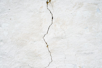 Cracked whitewashed wall © rootstocks