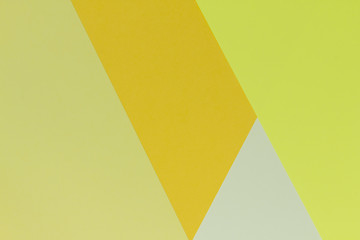 Creative geometric  paper  background. Pattern of similar (monochrome) shades of yellow. Abstraction.  Flat lay.