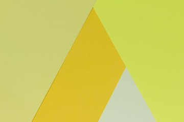 Creative geometric  paper  background. Pattern of similar (monochrome) shades of yellow. Abstraction.  Flat lay.