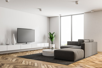 White living room interior with a TV set