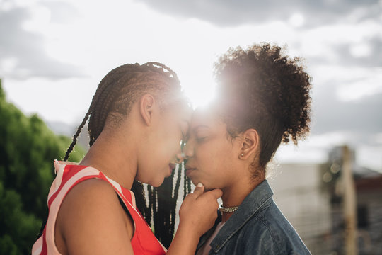 Side view of couple embracing outdoors