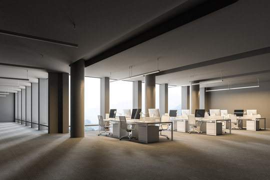 Corner of a spacious gray wall open space office