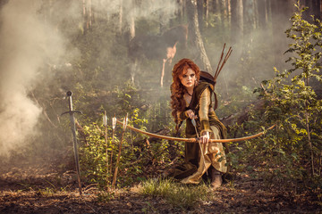 Fantasy medieval woman hunting in mystery forest - obrazy, fototapety, plakaty