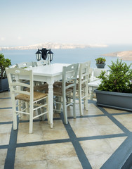 Santorini table and chairs balcony, Greece