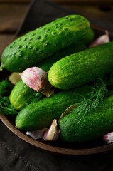 Fresh cucumbers on a old wooden background