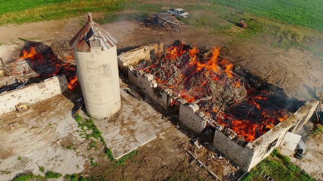 Old barns burning, flames and fire, aerial view. this was a controlled (planned) burn.

