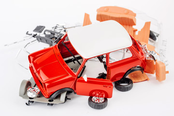 kit for assembling gray plastic car model on white background