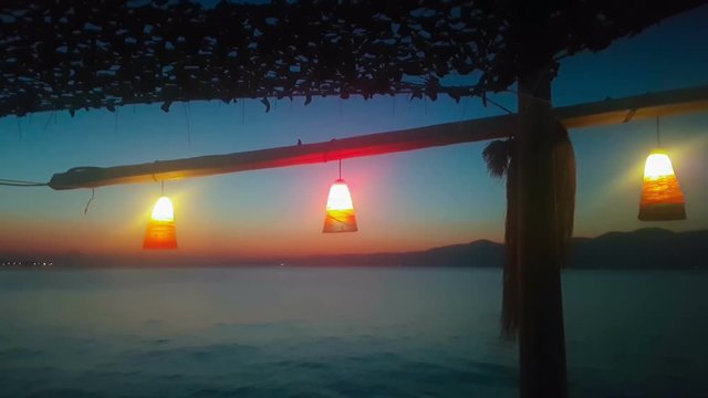 Night scenery at Kalamos in Greece with the sea view and the lights.