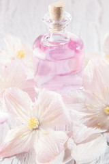 Fototapeta na wymiar Perfume bottle and white flowers