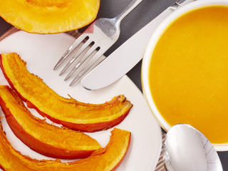 Slices of roast pumpkin and pumpkin soup