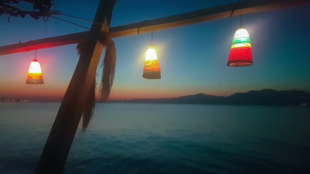 Summer vacations at Kalamos in Greece. Sea night view with lights.