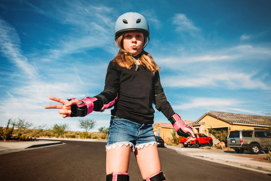 Young Girl on Rollerblades in Street