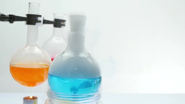 blue color of chemical mixing in jar with coppy space