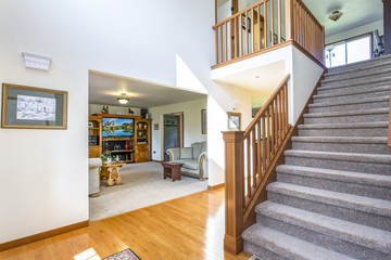 Foyer interior with grey staircase.