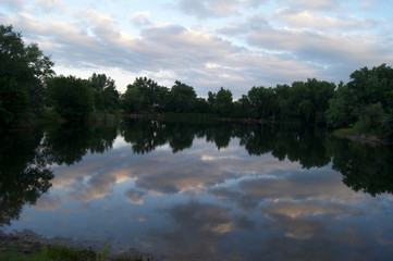 Fototapeta na wymiar Cloud Reflections In Lake At Sunset