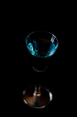 refreshing liqueur in a tall glass, alcoholic drink prepared by the bartender