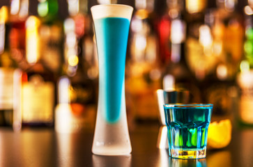 refreshing liqueur in a tall glass, alcoholic drink prepared by the bartender